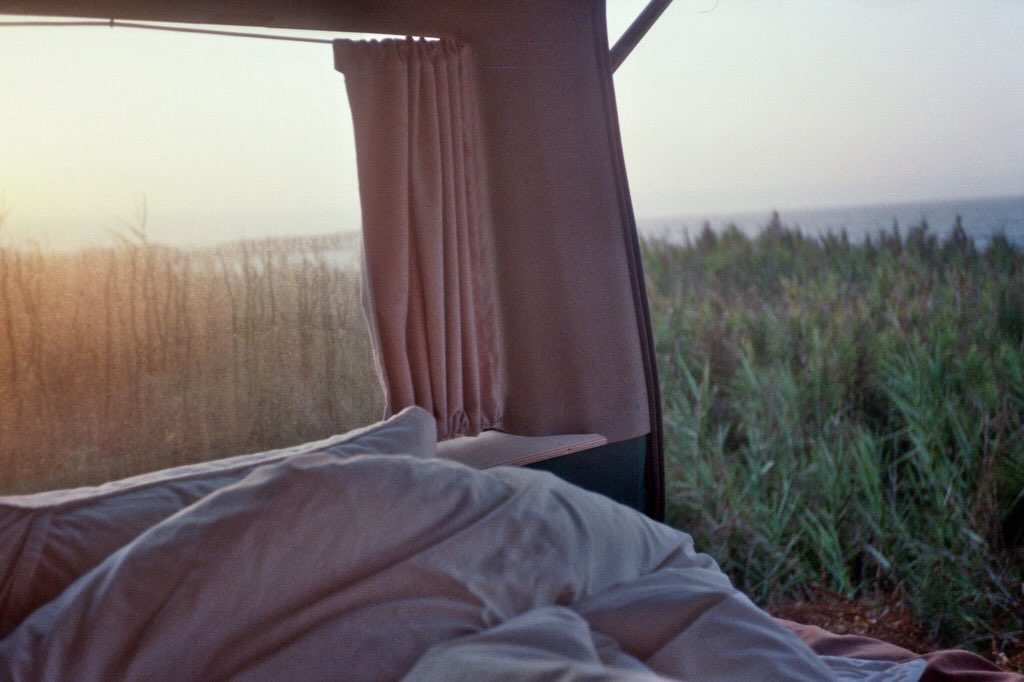 Cosy vintage camper van interior overlooking the coast